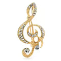 Broche en forma de clave de sol plateado y dorado